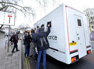Photographers chase after a van believed to be carrying Dutch engineer Vincent Tabak outside Bristol Magistrates' Court, where he appeared accused of the murder of Joanna Yeates.