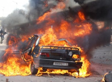 A burning car during a demonstration in Marrakech in one of a string of nationwide protests that brought thousands to the streets across Morocco on Sunday Feb. 20, 2011.