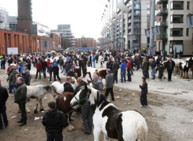 Gardai at the scene where two men were injured during a shooting attack at the Smithfield Horse Fair in Dublin.