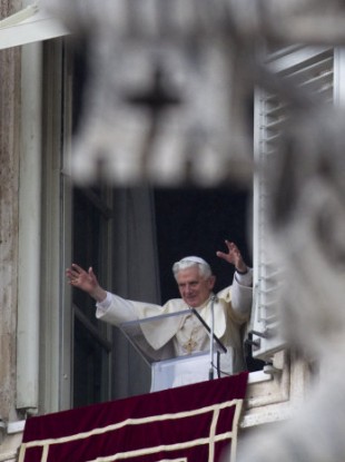 Pope Benedict XVI delivers his blessing during the Angelus noon prayer celebrated from the window of his studio overlooking St. Peter's square at the Vatican, Sunday, March 13, 2011.