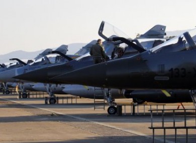 French Mirage 2000 jet fighters are prepared for a mission to Libya, at Solenzara 126 Air Base, Corsica island, Mediterranean Sea, Wednesday, March 23, 2011.