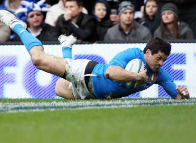 taly's Andrea Masi scores a try against Scotland last week.