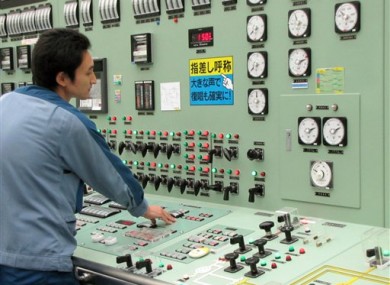 In this Sept. 2010 photo, an operator works at Unit 3 reactor of the Fukushima Daiichi Nuclear Power Plant in Okumamachi, Fukushima Prefecture.