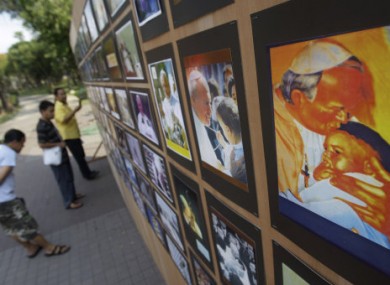 Filipinos look at a photo exhibit showing the late Pope John Paul II's visits to the country on April 27, 2011. The beatification of the late Pope John Paul II is to take place on Sunday 1 May.