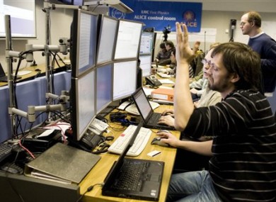 File photo shows a scientist in one of CERN's control rooms.