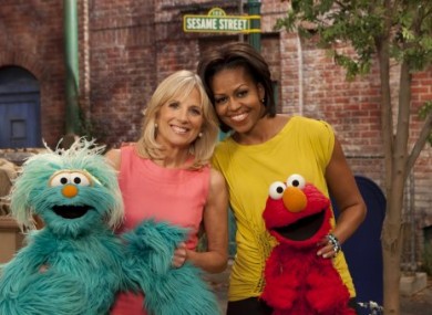 US first lady Michelle Obama and Jill Biden, the wife of US vice president Joe Biden, pose with Sesame Street characters on 18 April, 2011.