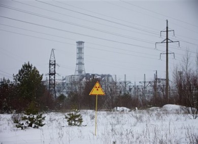 A radiation attention sign is seen in front of the building of Reactor No. 4 at the Chernobyl nuclear power plant in Ukraine.