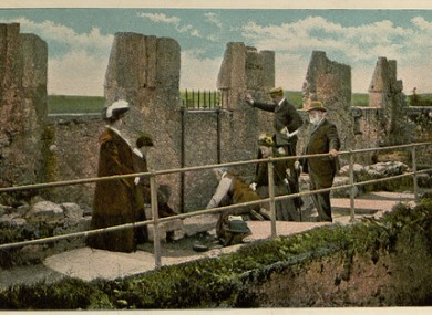 A tourist postcard depicting the Blarney Stone c. 1900