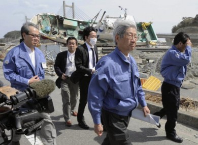 Makoto Iokibe (center R), head of the Japanese government's Reconstruction Design Council, visits Soma port in Fukushima Prefecture.