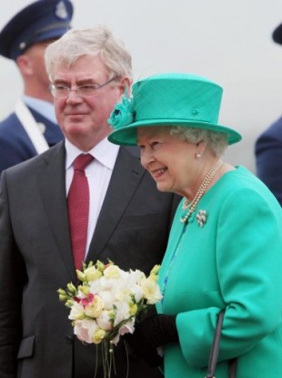 Britain's Queen Elizabeth II is greeted by Tanaiste Eamon Gilmore upon arrival at Casement Aerodrome, Baldonnel, ahead of a four day state visit.