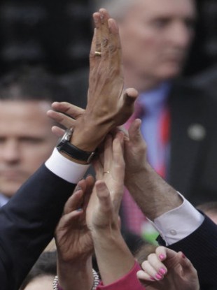 US President Barack Obama gives a high five to a well wisher after his speech at College Green, Dublin.