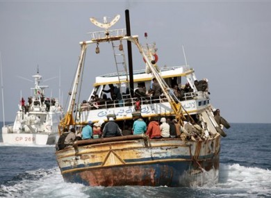 In this photo provided by the Italian Coastguard, a boat reportedly carrying 760 migrants is escorted to the Lampedusa harbor, Italy, Tuesday, April 19, 2011.