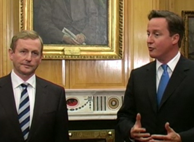 Britain's prime minister David Cameron speaks to the media as Taoiseach Enda Kenny looks on.