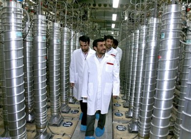 In this Tuesday, April 8, 2008 file photo released by the Iranian President's Office, Iranian President Mahmoud Ahmadinejad, center, visits the Natanz Uranium Enrichment Facility.
