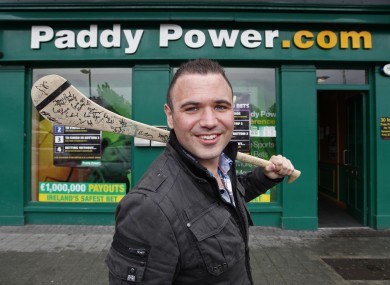 'Jobless Paddy' joins Paddy Power: Féilim Mac An Iomaire poses outside a bookies' outlet earlier today, on his first day working for the company.