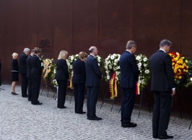 German officials attend a wreath laying ceremony at the commemoration of the 50th anniversary of the construction of the Berlin Wall.