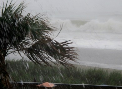 Rains and waves from Hurricane Irene batter the shore in downtown Myrtle Beach, South Carolina
