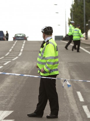Police outside Tottenham Hale Underground station in north London, after a man was shot dead in north London during a police operation