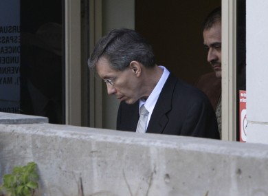 Warren Jeffs, left, is escorted out of the Tom Green County Courthouse
