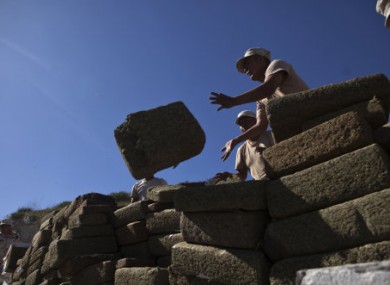 File photo shows soldiers piling marijuana blocks before burning them in Tijuana, Mexico.