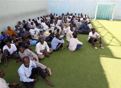 Men suspected of being mercenaries for Moammar Gadhafi, are held in a district sports center next to the medina, set up as provisory jail in Tripoli, Libya, Tuesday, Aug. 30, 2011.