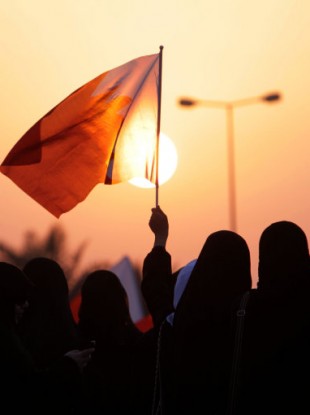 Protesters wave national flags and chant anti-government slogans during an all-women rally against alleged police brutality toward women Thursday, Sept. 29, 2011, in Miqsha, Bahrain.