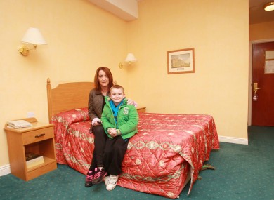 Niamh Ryan and her son Clyde, who turned 7 today, in the Regency Hotel in Dublin. They are being housed in the hotel after being told to evacuate their home at the Priory Hall apartment complex.