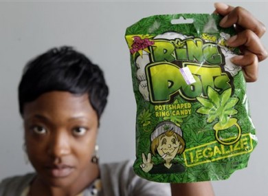 Felicia Williams, Community Liaison for Buffalo City Council member Darius Pridgen, holds a package of 'Ring Pots' sweets.