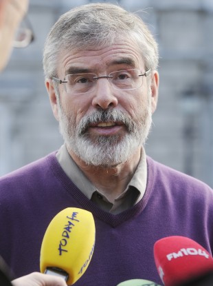 Gerry Adams gives the media his response to the Eurozone deal outside Leinster House in Dublin today.