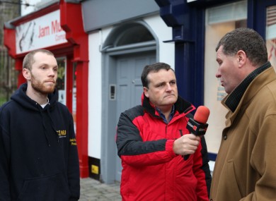 Munnelly (L) debates with Lawlor (R) outside the TD's constituency office in Naas this afternoon