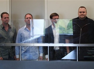 MegaUpload founder Kim Dotcom, far right with three of his employees in a New Zealand court.