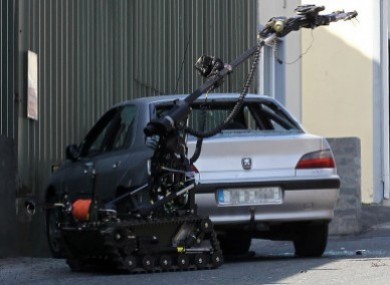 File photo of a bomb disposal robot examine a suspect device in a car