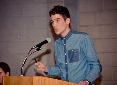 UCD Students' Union president Pat de Brún addresses last night's general meeting, the first of its kind for 24 years.
