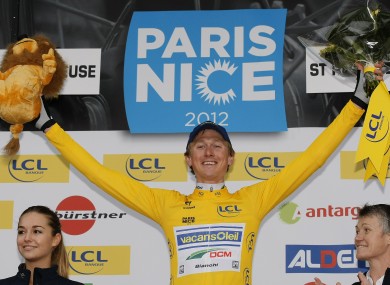 Sweden's Gustav Larsson reacts wearing the yellow jersey after winning the first stage time trial of Paris-Nice.