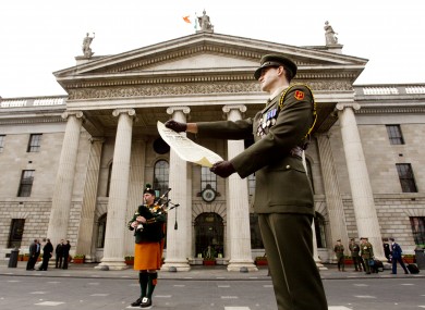 Captain Shane Keogh reads a copy of the original 1916 Proclamation of Independence at the GPO today, to mark the 96th anniversary of the 1916 Easter Rising.