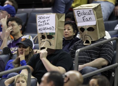 Chrlotte Bobcats fans watch their side's loss to New York.