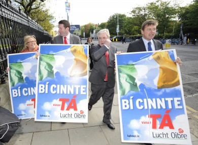 Tanaiste Eamon Gilmore tries to get first past the post(er).