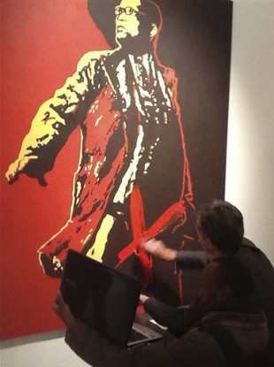 An unidentified man attacking the painting The Spear.