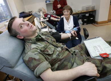 Irish soldier giving blood at an appeal in 2010
