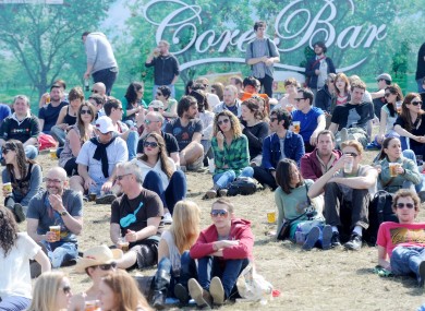 People enjoy the sun at the Forbidden Fruit music festival in Dublin today.
