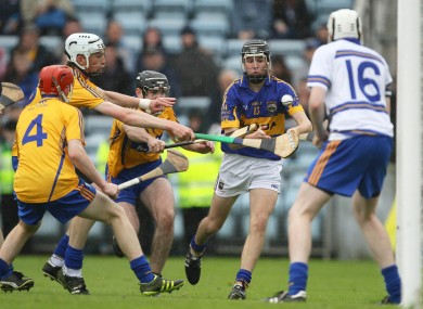 Tipperary's Mark McCarthy under pressure from by Gearoid Ryan, Colin Vaughan and Brian Carey of Clare.