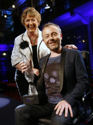 2FM's Rick O'Shea cradles his Celebrity Mastermind trophy, with host Nora Owen.