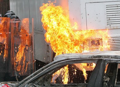 Protesters clash with police in Ardoyne following an Orange Order parade in North Belfast on July 12, 2012.