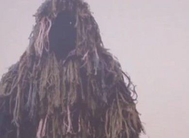 An example of the 'ghillie' suit clothing worn by the man.
