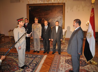 gyptian President Mohammed Morsi, left, swears in newly-appointed Minister of Defense, Lt. Gen. Abdel-Fattah el-Sissi, in Cairo, Egypt, Sunday, Aug. 12, 2012