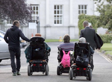 Heading into a meeting at Leinster House are Martin Naughton from Baldoyle, Leigh Gath from Limerick and Joe T Mooney from Lucan.