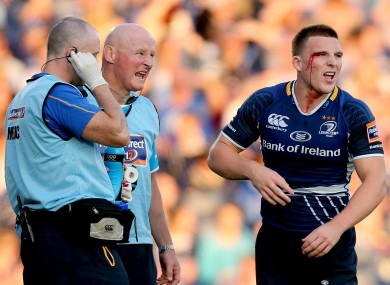 Ouch: Andrew Conway is treated for an eye injury