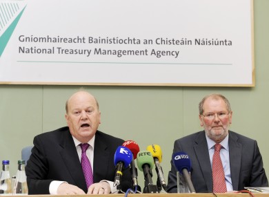 Minister for Finance Michael Noonan (left) and Chief Executive of the NTMA, John Corrigan, will be pleased at the outcome of this morning's auction.