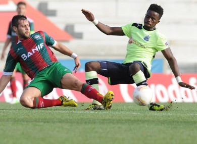 Newcastle United's Gael Bigirimana, right, from Burundi challenges Maritimo's David Simao for the ball during their Europa League Group D soccer match at the Barreiros stadium.