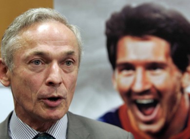 Jobs Minister Richard Bruton with a picture of football superstar Lionel Messi